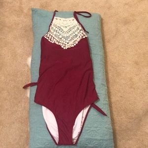 Maroon one piece with lace embellishment at top